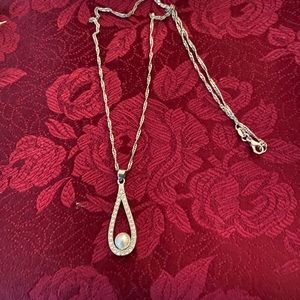 Sterling silver necklace with small rhinestones and pearl center